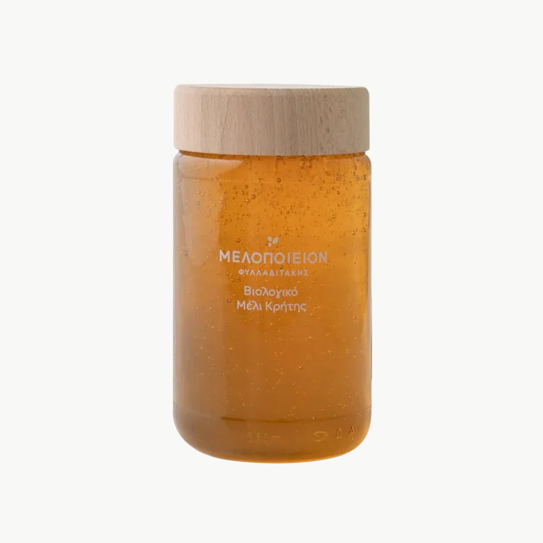 Organic raw Greek honey in glass jar